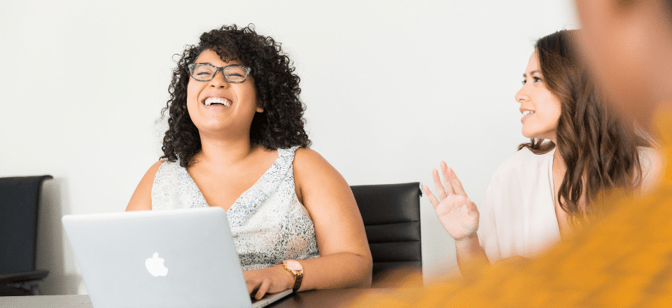 Women laughing at work